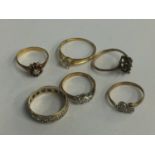 Three rings stamped 9ct, 6.4g, an 18ct ring, 2.7g, one stamped '585', 2.3g and one other