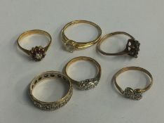 Three rings stamped 9ct, 6.4g, an 18ct ring, 2.7g, one stamped '585', 2.3g and one other