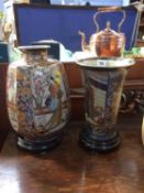 Two Oriental vases and stands