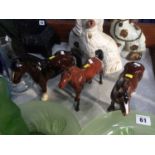 Two Beswick horses and one other
