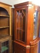 A yew wood corner cabinet