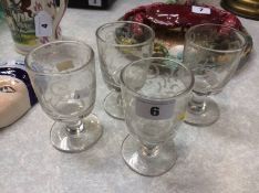 Four engraved glasses