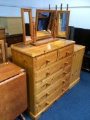 Three pine chest of drawers and a dressing table mirror