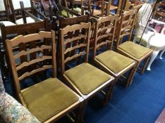 Four oak ladderback chairs and an uplighter