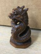 A carved boxwood netsuke