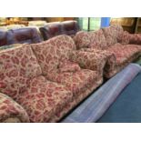 Two large red floral settees