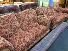 Two large red floral settees