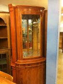 A yew corner cabinet