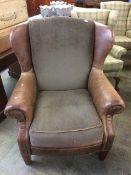 Worn leather brown armchair