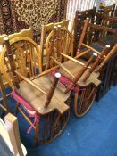 Four Windsor wheel back chairs