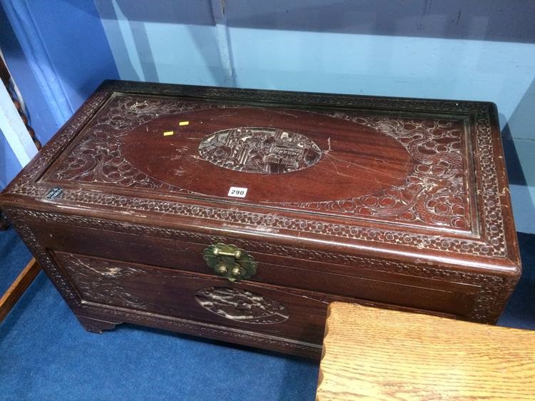 A carved Oriental Camphorwood chest