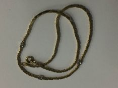 A 9ct gold necklace set with diamonds, 11.3g