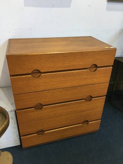 A Meredew teak chest of drawers with six drawers and inset circular handles, 81cm wide