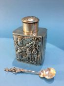 An Oriental white metal tea caddy, decorated with embossed dragons, marked 'Tuchchang' to base