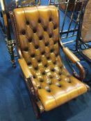 A Chesterfield button back open armchair