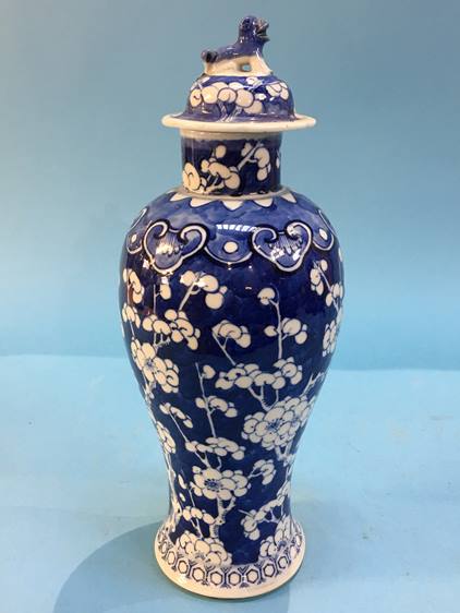 An Oriental lidded blue and white vase