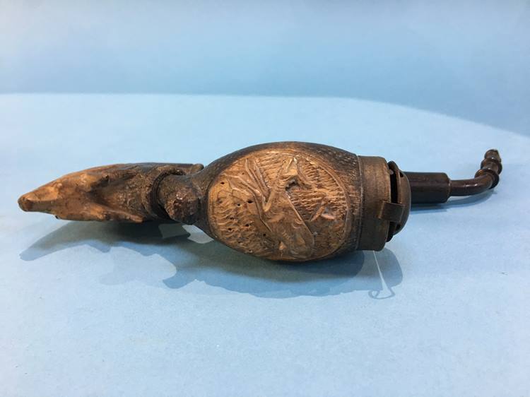 A carved Black Forest style pipe, decorated with deer