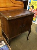 A walnut record cabinet