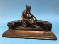 A good quality bronze inkwell in the form of Hermes holding a scroll sat on a bench