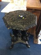 A carved oak octagonal occasional table