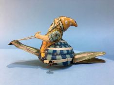 Clockwork tin plate figure of a gnome riding a snail, made in Germany