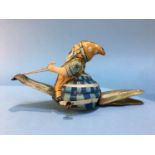 Clockwork tin plate figure of a gnome riding a snail, made in Germany