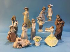 Collection of various figures including Lladro, Nao etc.