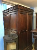 A Barker and Stonehouse type bedroom suite, comprising a pair of wardrobes and matching chest of