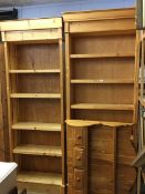 Two open pine bookcases and a pine delft rack
