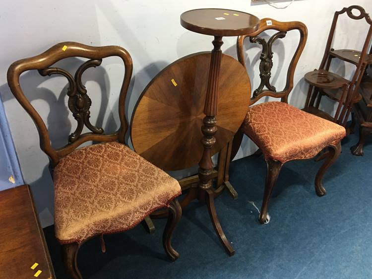 A pair of Victorian rosewood balloon back chairs