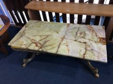 An Onyx and brass coffee table