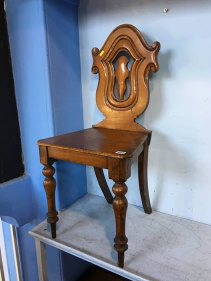 A 19th century oak hall chair