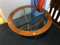 A Gomme teak 'Astro' glass coffee table