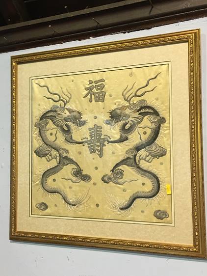A pair of Oriental silk panels, decorated with dragons, 41 x 42cm