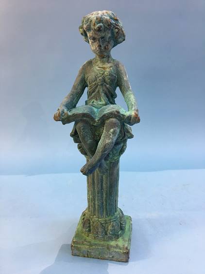 A cast figure of a girl on a column