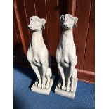 Pair of composite seated Whippets
