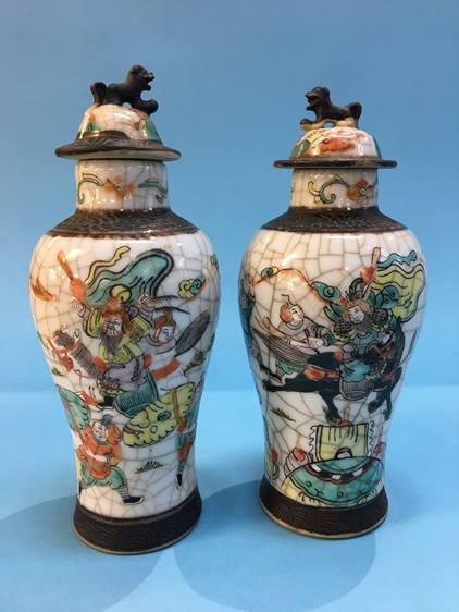 A pair of Oriental lidded vases