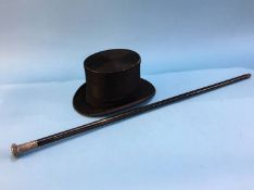 A boxed top hat and cane