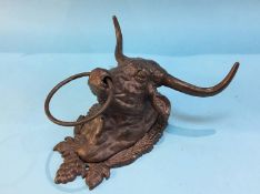 A cast Bulls head towel holder