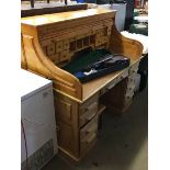 A pine tambour fronted desk