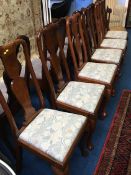 A single cane seated chair and six Queen Anne style chairs