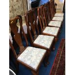 A single cane seated chair and six Queen Anne style chairs