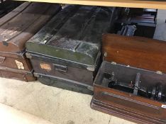 Two trunks and a sewing machine