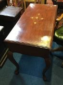 An Oriental and brass inlaid two drawer side table