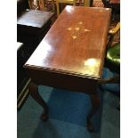 An Oriental and brass inlaid two drawer side table