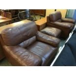 Pair of brown leather armchairs and footstool