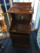 An Edwardian mahogany coal scuttle