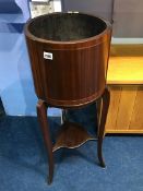 An Edwardian mahogany plant stand