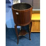 An Edwardian mahogany plant stand