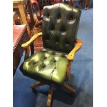 A green leather Chesterfield office chair